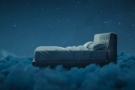 Imagem que representa um sonho: uma cama confortável, sobre uma nuvem, com o céu estrelado ao fundo
